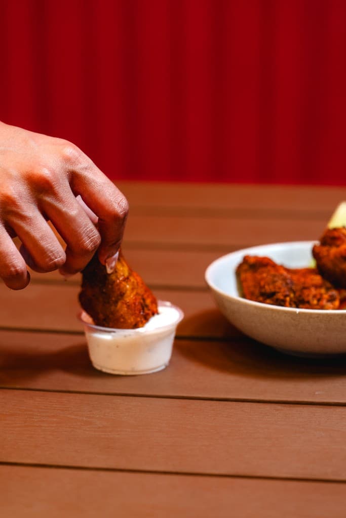 Crispy buffalo wings with ranch at Outfield Bar happy hour in Navy Yard