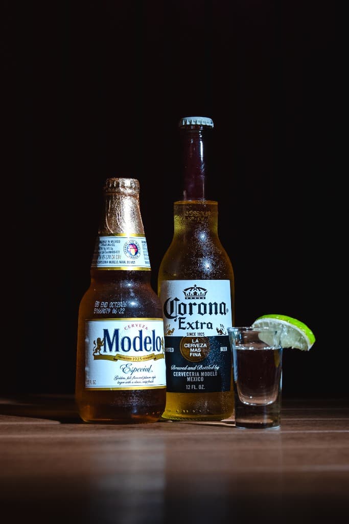 Daily beer and tequila shooter specials at Outfield Bar DC — Modelo, Corona, and lime