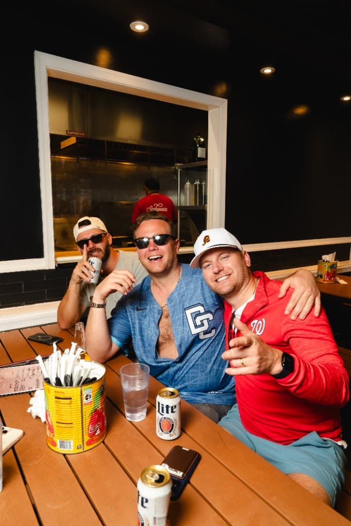 Guests enjoying drinks at Outfield Bar in Navy Yard near Nationals Park with Scolapasta kitchen