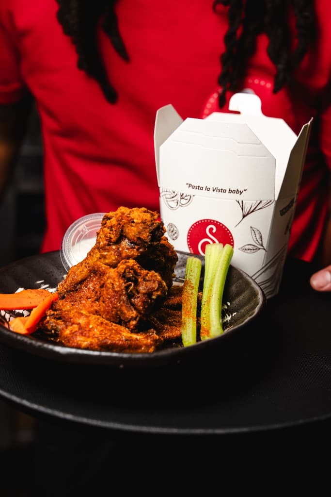 Scolapasta seasoned wings and Pasta la Vista takeout at Outfield Bar Nats Park